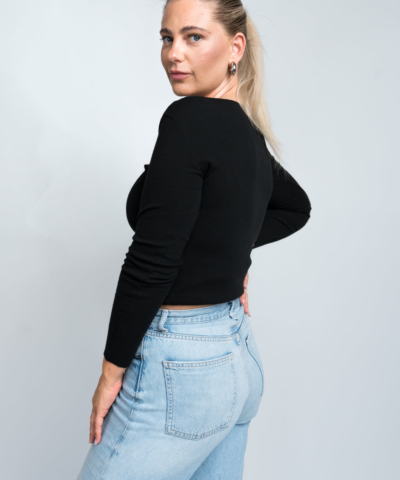 Langarmshirt mit Wellenkante Schwarz seitlich